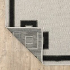 Trinity Corner Detail Border Patio Area Rug Beige/Black - Captiv8e Designs -Safavieh Outlet Store GUEST 3d6f8a2b bf03 472d be0a 7f6f138e7ade