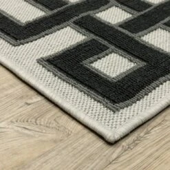 Trinity Corner Detail Border Patio Area Rug Beige/Black - Captiv8e Designs