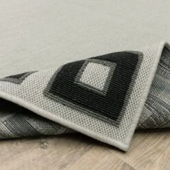 Trinity Corner Detail Border Patio Area Rug Beige/Black - Captiv8e Designs -Safavieh Outlet Store GUEST 71823b7c 4fa8 4dec 8a00 98ab8b24f2fa