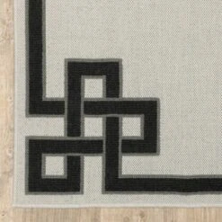 Trinity Corner Detail Border Patio Area Rug Beige/Black - Captiv8e Designs -Safavieh Outlet Store GUEST 76671b65 f2a1 41af 8e3b 79e04081bc1b